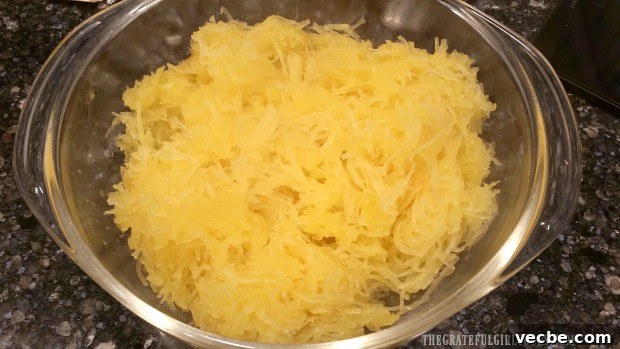 How To Cook Spaghetti Squash Cooked spaghetti squash strands in a bowl ready to serve or use in recipes