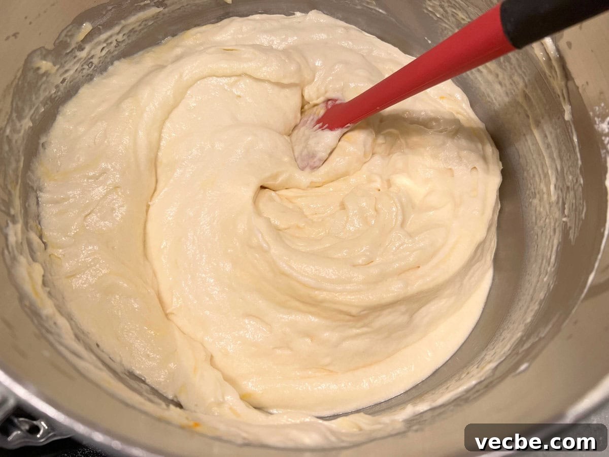 Lemonade Layer Cake Recipe with Bright Lemon Frosting 6 Lemonade Layer Cake Batter in mixing bowl.