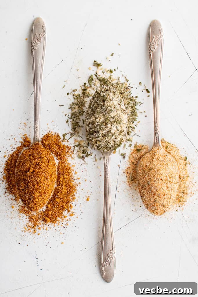 Baked Potato Seasoning for Crispy Oven Potatoes 2 Top down view of three spoons full of seasoning blends.