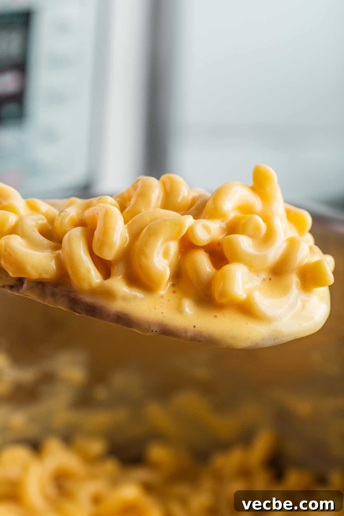 Creamy Instant Pot Mac and Cheese 6 Mac and cheese on wooden spoon