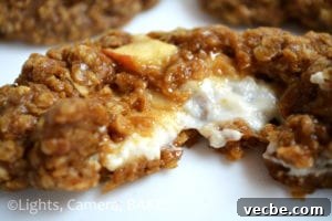Cheesecake-Stuffed Spiced Apple Cookies 2 Cheesecake Stuffed Spiced Apple Cookies. Warm, comforting spiced oat cookies with apple and cheesecake filling.