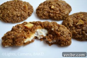 Cheesecake-Stuffed Spiced Apple Cookies 4 Cheesecake Stuffed Spiced Apple Cookies. A close-up of a cookie with cheesecake filling.
