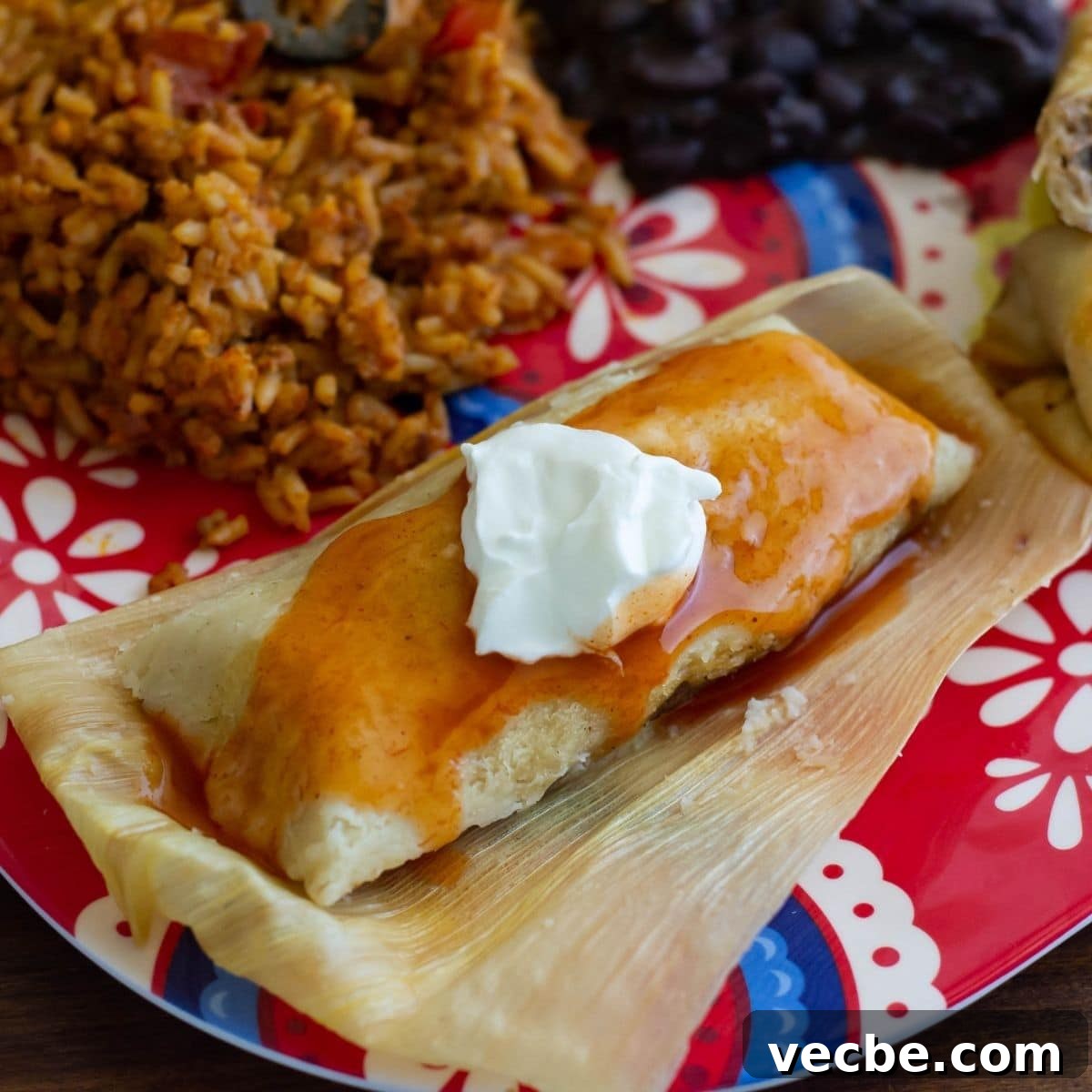 Shredded Beef Tamales with Red Chile Sauce 2 A homemade tamale on a dinner plate.