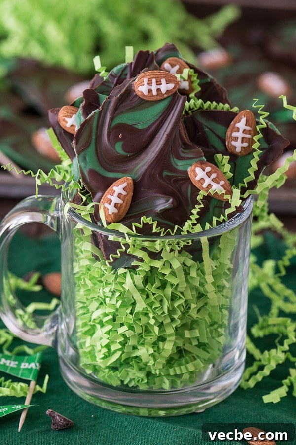 Game Day Football Chocolate Bark 3 Football bark with chocolate, green candy melts, and almond football decorations.
