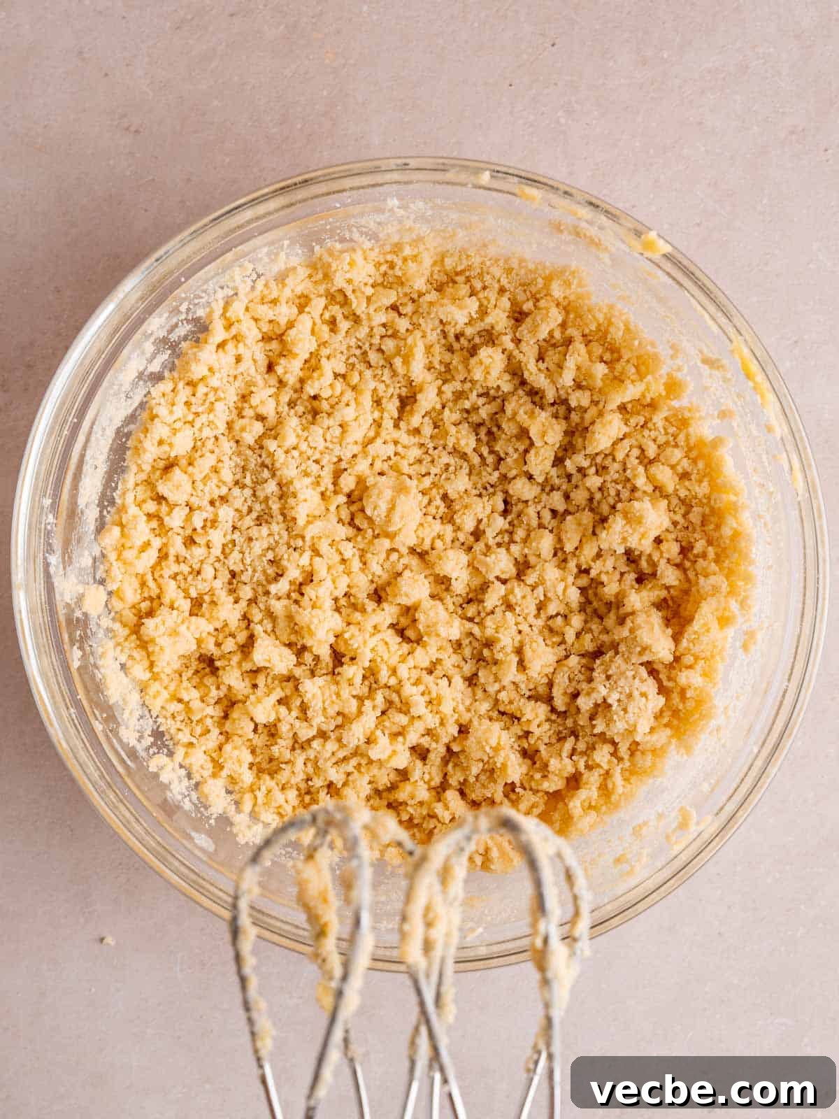 Raspberry Crumble Cookies Better Than Costco 5 Crumbly shortbread cookie dough in a bowl.