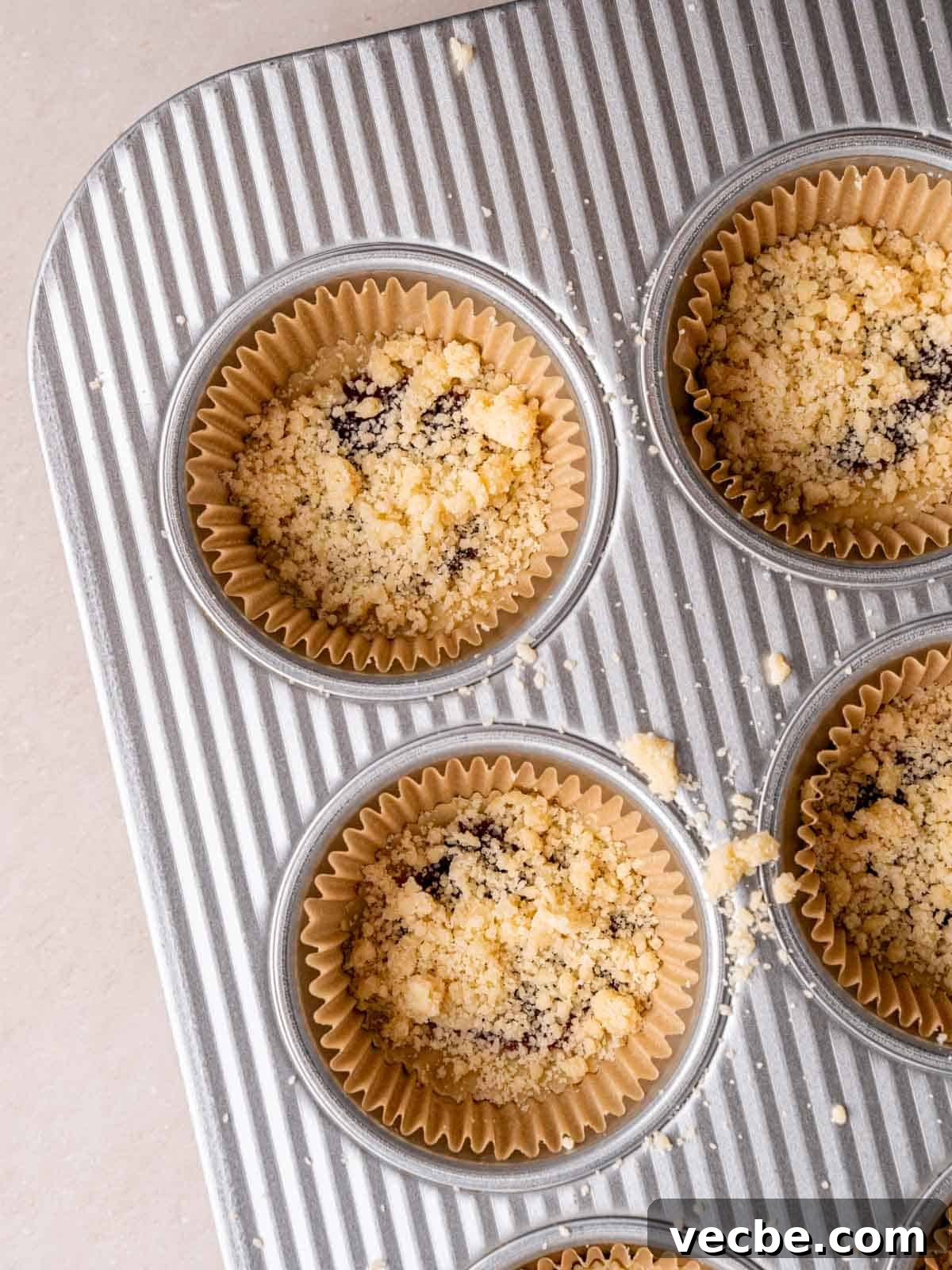 Raspberry Crumble Cookies Better Than Costco 8 Unbaked raspberry filled cookies in a pan.