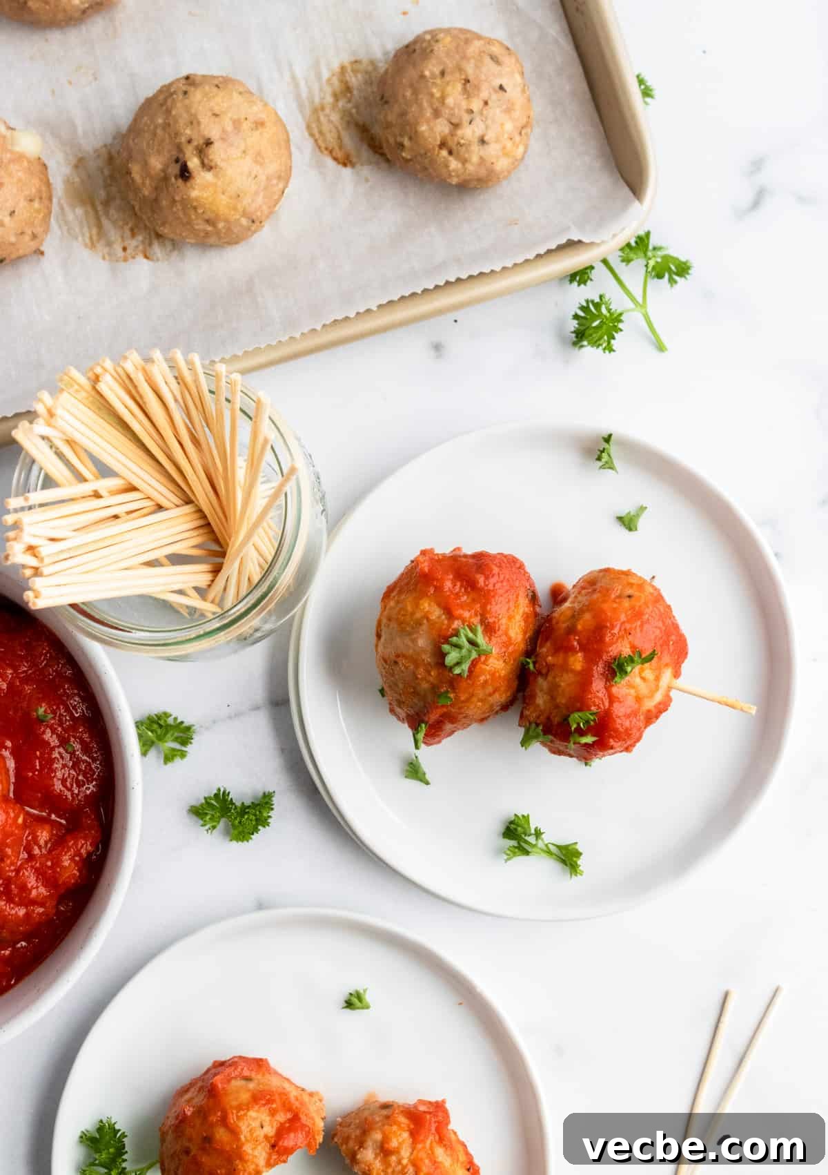 Mozzarella Stuffed Turkey Meatballs Recipe 7 Meatballs on plate with toothpicks.
