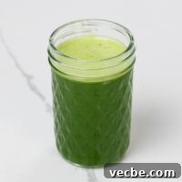 Fresh Spinach Juice Recipe for Energy and Detox 6 spinach juice with pineapple, green apple, and lime in a small glass