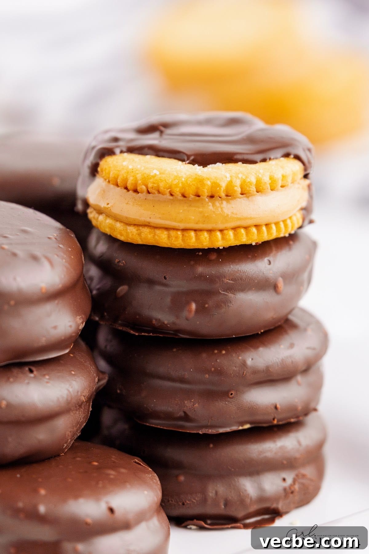 Chocolate-Dipped Peanut Butter Ritz Cracker Bites 12 Stacks of Chocolate Dipped Peanut Butter ritz crackers showing the insides, with text overlay.