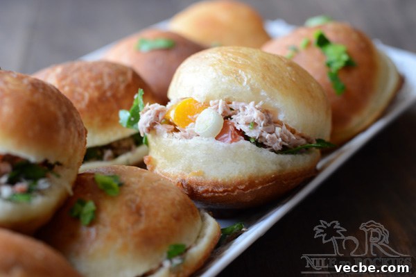 Tuna-Stuffed Pan-Fried Bread 3 Fried buns stuffed with tuna placed on a serving plate.