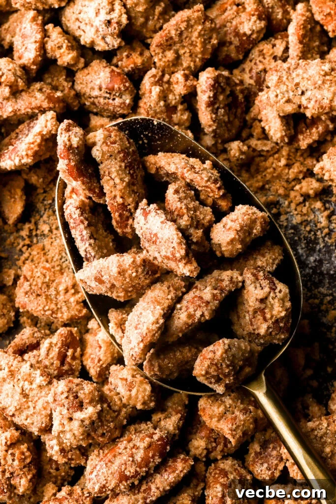 Southern Praline Pecans Recipe 7 praline pecans getting scooped out of the pan