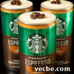 Canned Espresso Martini Cocktail 5 Three open cans of Starbucks Espresso and Cream topped with cold foam and espresso beans.