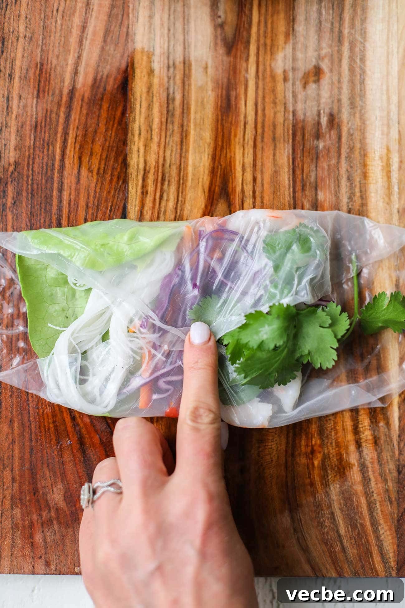 Vietnamese Spring Rolls Recipe with Peanut Dipping Sauce 12 Fold the rice paper so the top meets the bottom edge.