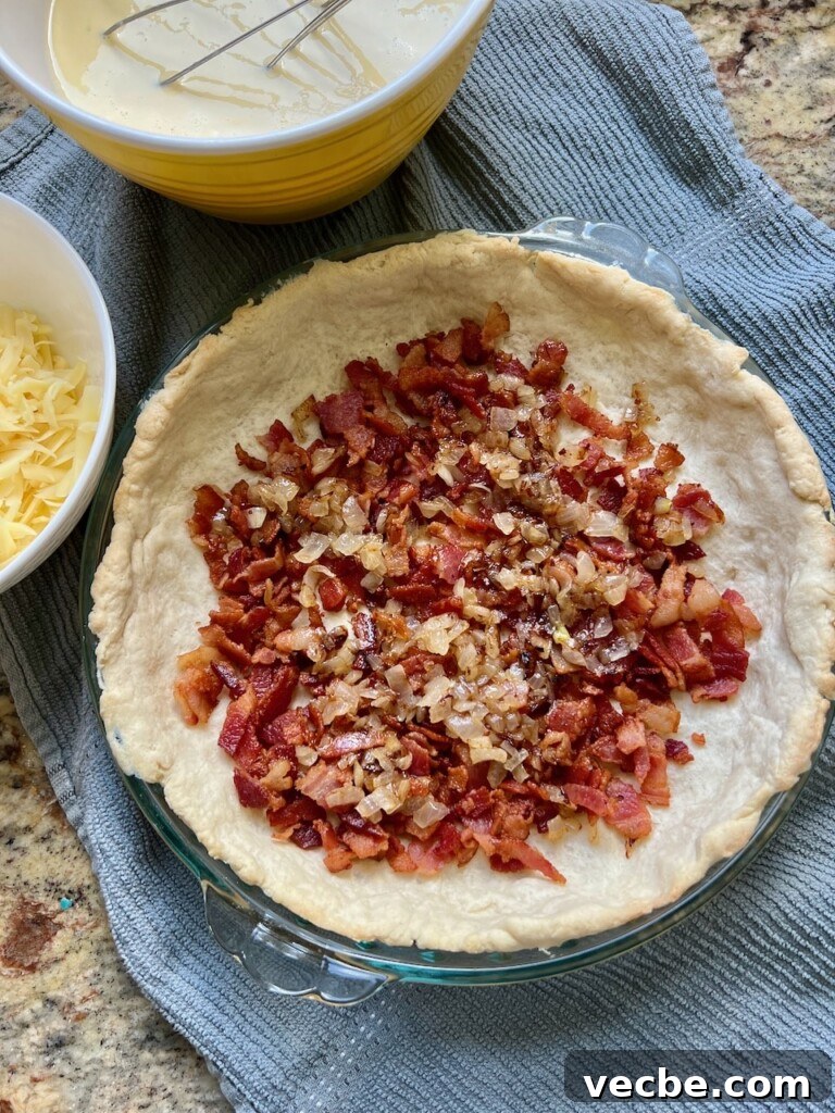 Rustic Sourdough Quiche with Creamy Egg Filling 6 Layering bacon and cheese in quiche