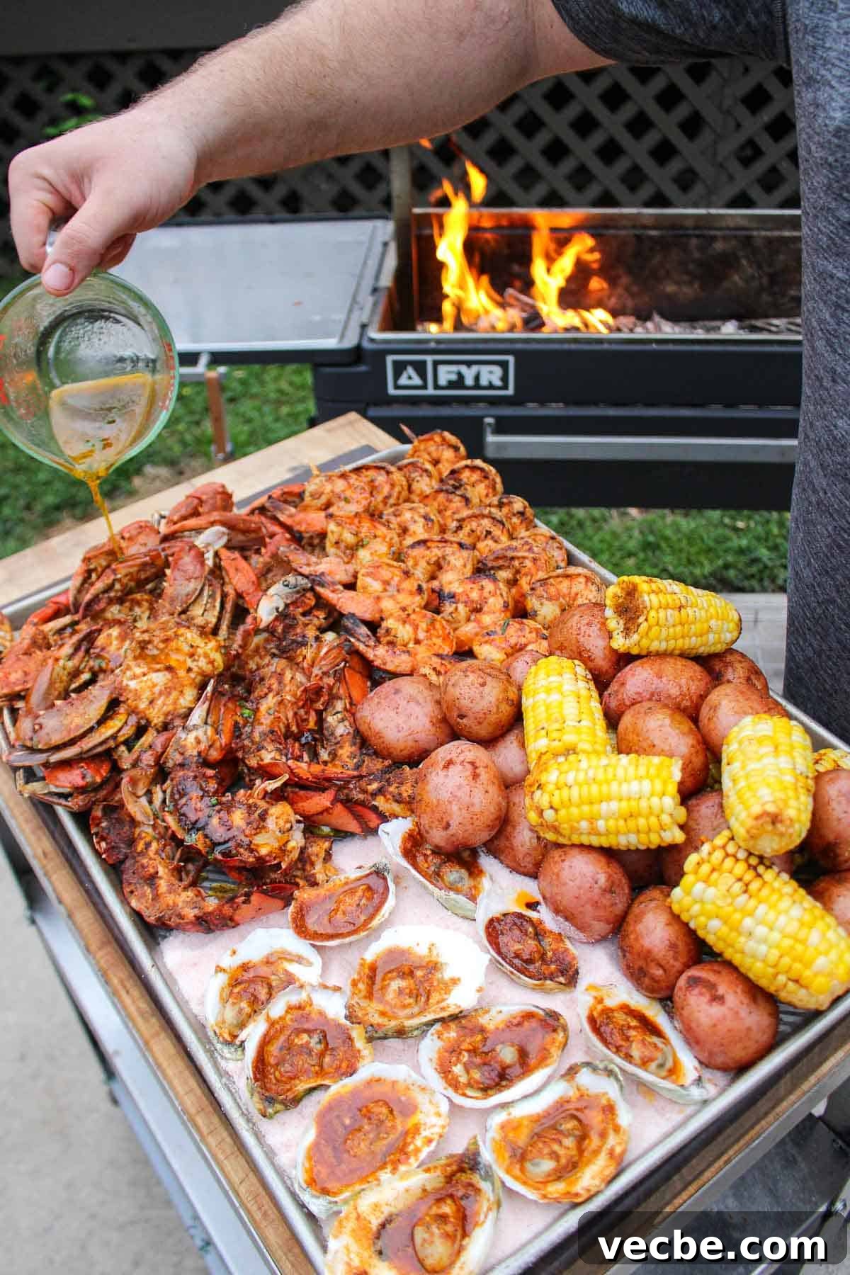 How to Make a Grilled Seafood Platter 3 More sauce is poured over the feast.