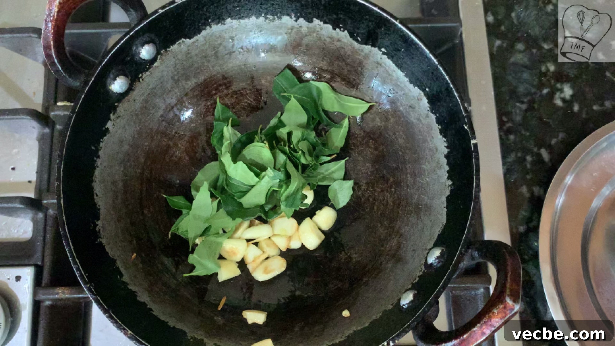 Milagu Kuzhambu Recipe South Indian Pepper Curry 14 Adding curry leaves