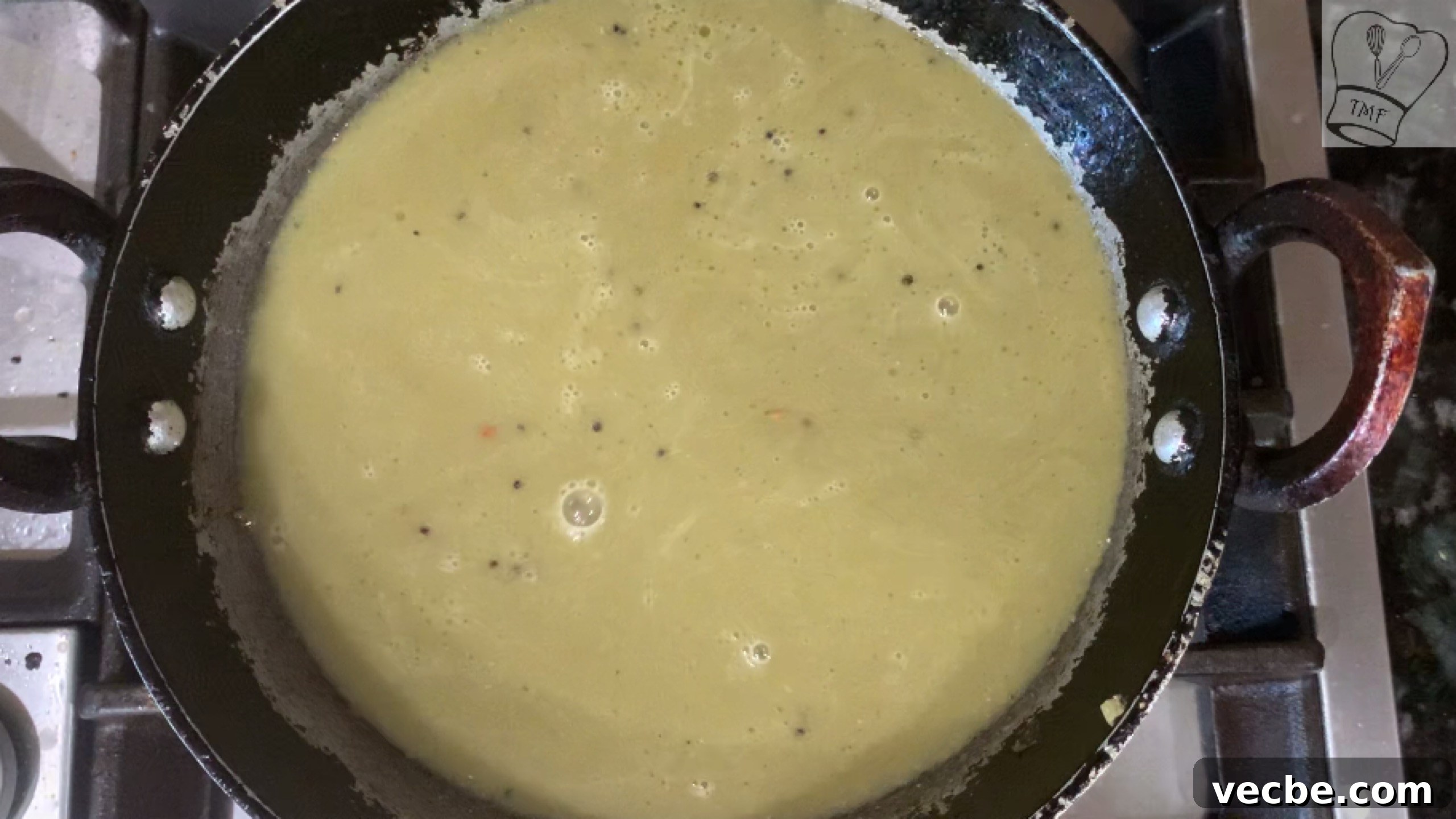 Milagu Kuzhambu Recipe South Indian Pepper Curry 19 Adding water to kuzhambu paste