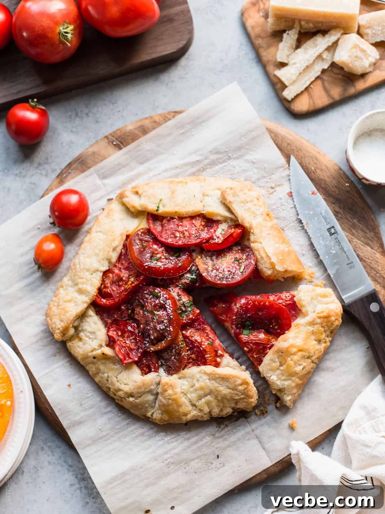 Rustic Tomato and Ricotta Galette Recipe 7 Cutting a slice from a Tomato Ricotta Galette.