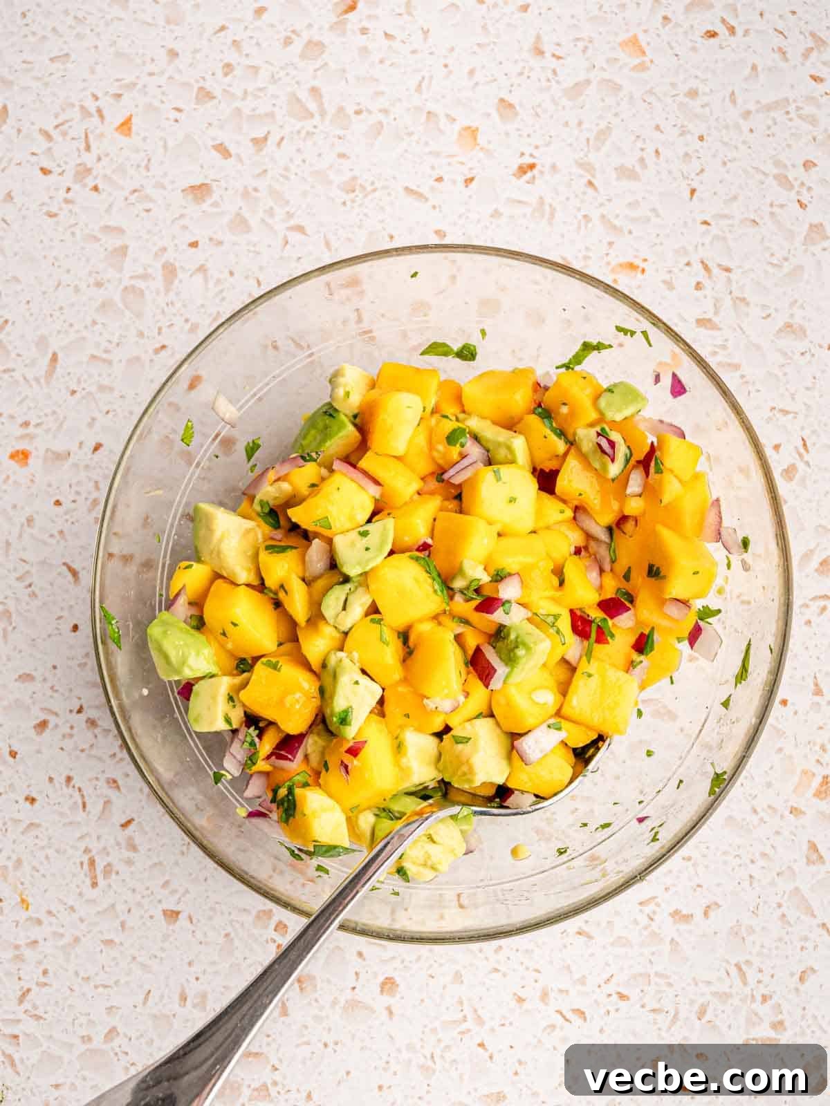 Crispy Fish Tacos with Fresh Mango Salsa Recipe 9 Mango and avocado salsa in a bowl.