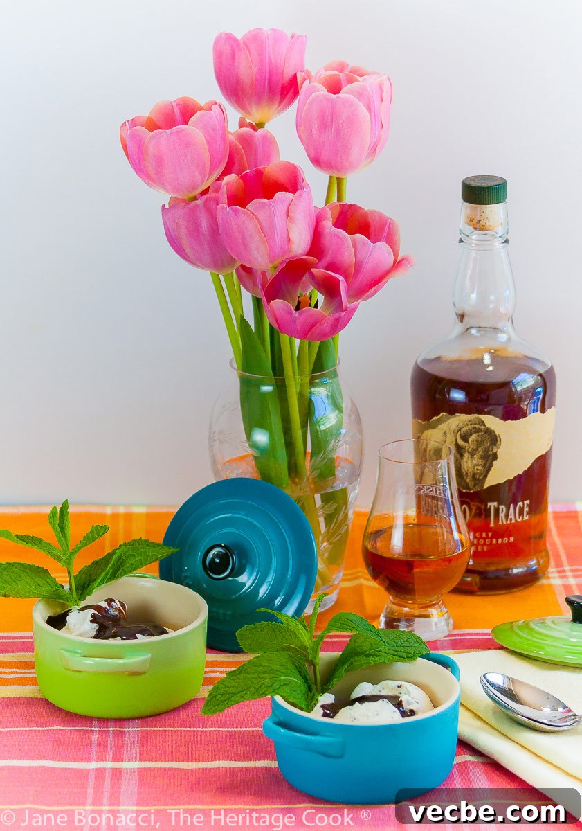 Kentucky Derby Ice Cream Sundaes with Chocolate Bourbon Syrup 6 Derby Sundaes with Chocolate Bourbon Sauce, tulips in a vase, glass of bourbon in front of the full bottle