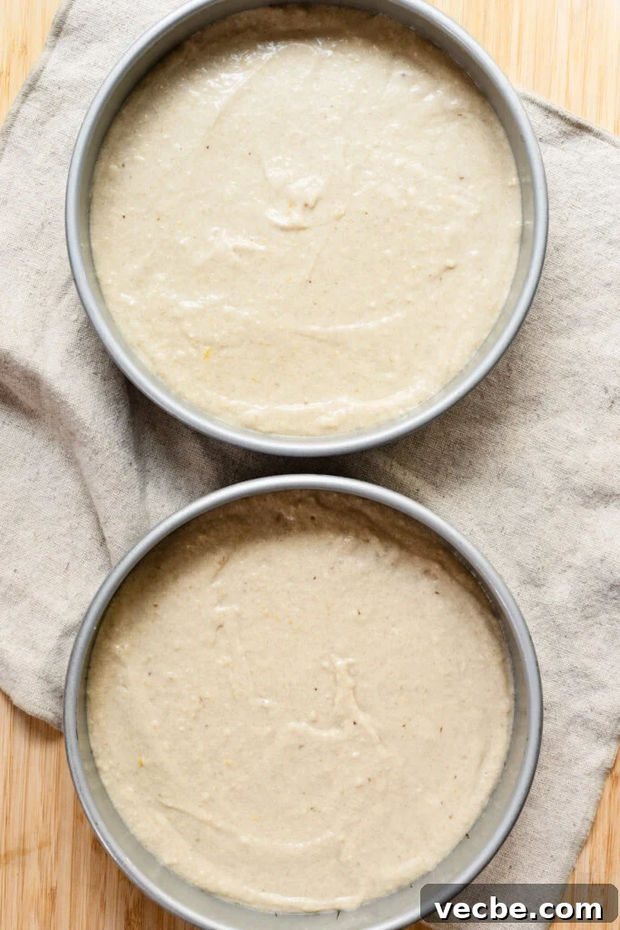 Moist Banana Layer Cake with Honey Buttercream Recipe 11 Overhead of two cake pans filled with batter.