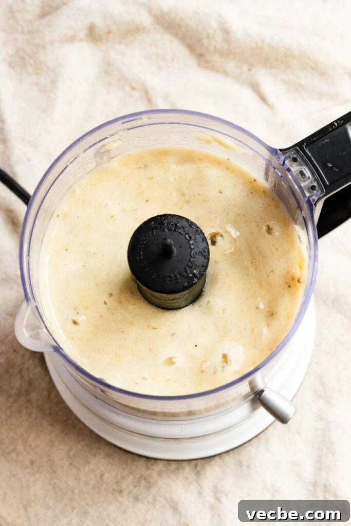 Moist Banana Layer Cake with Honey Buttercream Recipe 5 Blended bananas in a food processor.