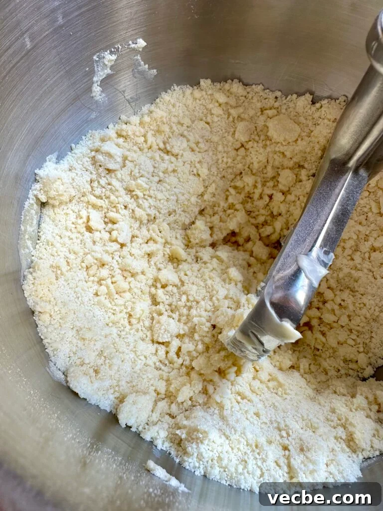 Moist Banana Layer Cake with Honey Buttercream Recipe 9 Reverse creaming butter into sugar and flour inside a stand mixer bowl.