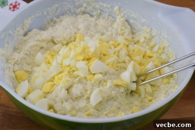 Creamy Mashed Potato Salad Recipe 9 Add chopped eggs to bowl.
