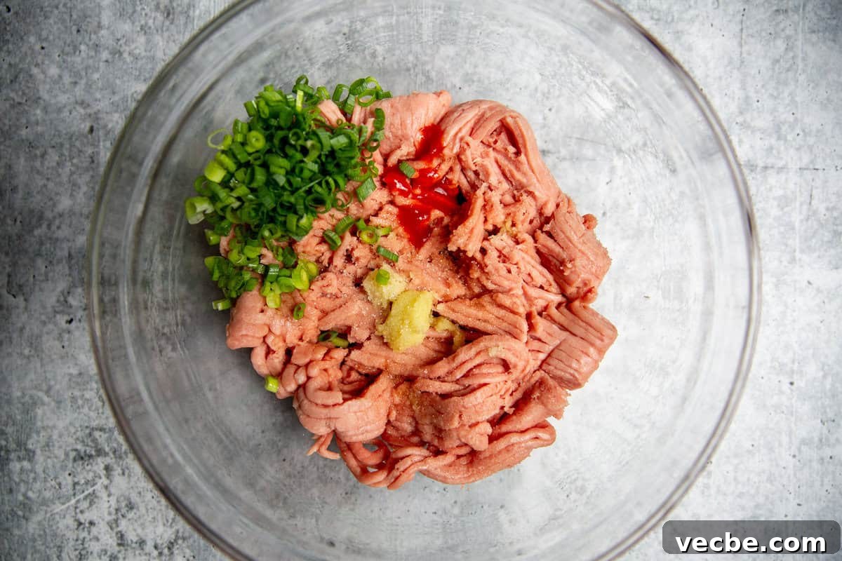 Banh Mi Burger Recipe with Sriracha Cream Cheese 4 burger ingredients in a glass bowl