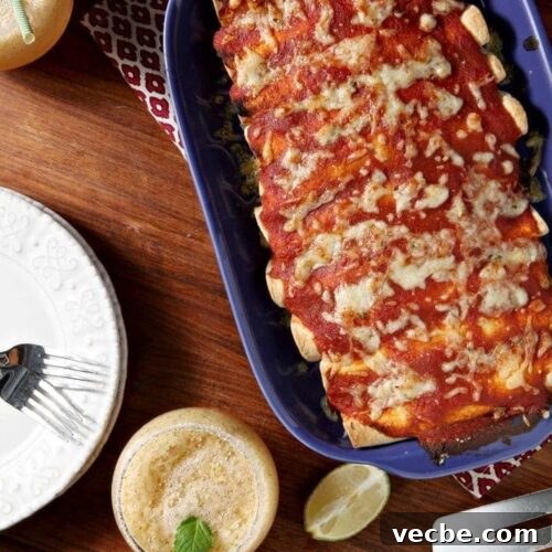 Pork Carnitas Enchiladas with Salsa Verde 6 Overhead of enchiladas, with melty cheese in blue dish