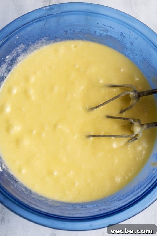 Italian Cream Cake Recipe with Pecan Cream Cheese Frosting 6 Beat eggs well with electric mixer.