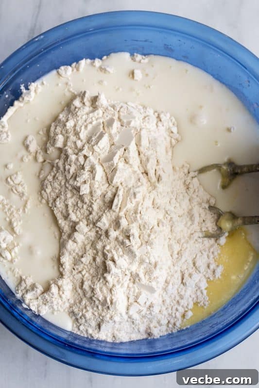 Italian Cream Cake Recipe with Pecan Cream Cheese Frosting 8 Add flour mixture to cake batter and mix well.