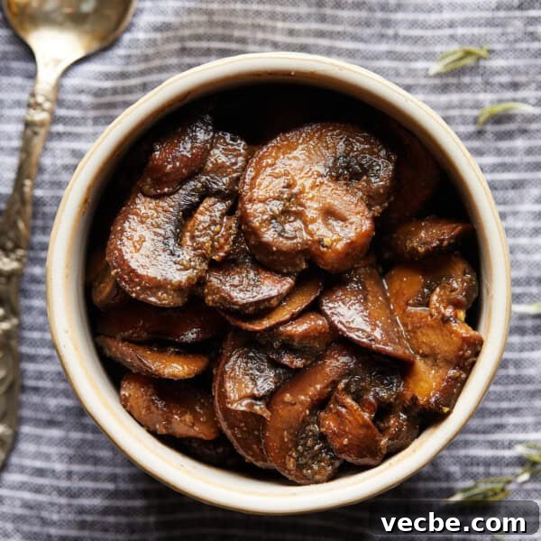 Blueberry Streusel Coffee Cake Recipe with Greek Yogurt 9 Overhead photo of browned sliced mushrooms in a small bowl on a striped cloth.