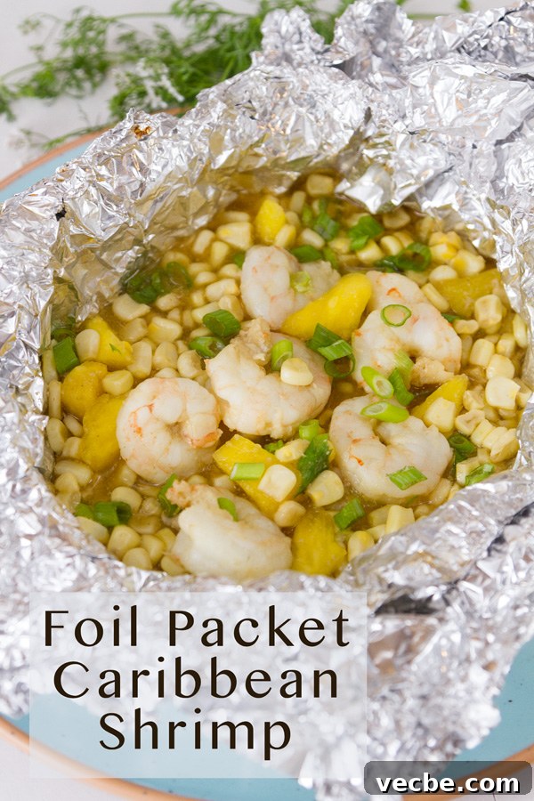 Caribbean Shrimp Foil Packets with Pineapple and Peppers 3 title on lower left: Foil Packet Caribbean Shrimp. Foil packet open to reveal the shrimp, corn, and pineapple inside