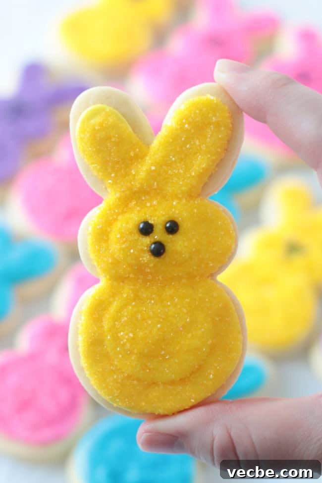 25 Irresistible Easter Dessert Recipes to Try 6 hand holding yellow peeps bunny sugar cookie