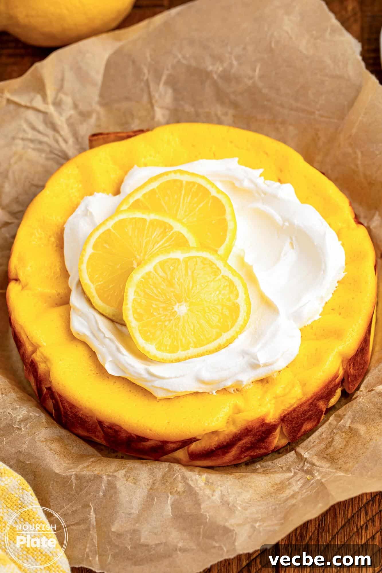 4-Ingredient Lemon Greek Yogurt Cheesecake 2 Lemon greek yogurt cheesecake topped with creamy topping and lemon slices