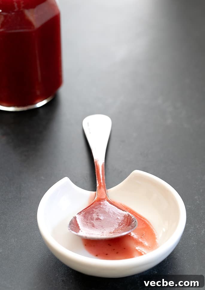 Homemade Strawberry Puree and Syrup Recipe 2 Serving spoon with strawberry puree
