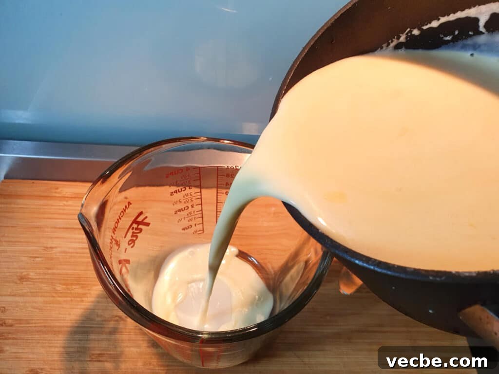 Cookies and Cream Ice Cream Recipe 12 Transferring ice cream mix to heat proof jug to chill in fridge.