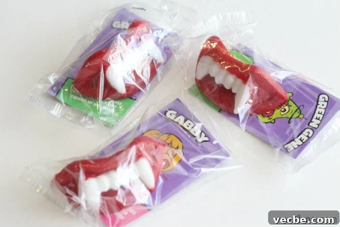 Slushy punch is fruity and fizzy and perfect for any occasion. Adding wax fangs make it a Halloween must! Wax lips