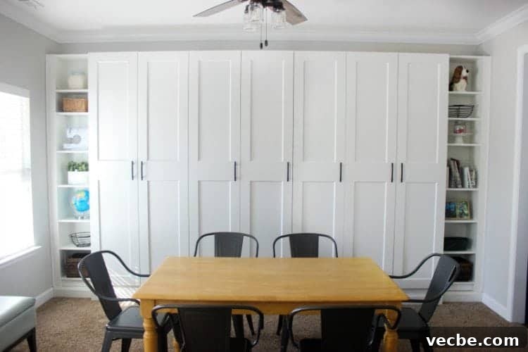 DIY IKEA Built In Storage Cabinets on a Budget 7 Finished wall of custom IKEA built-ins with doors and shelves