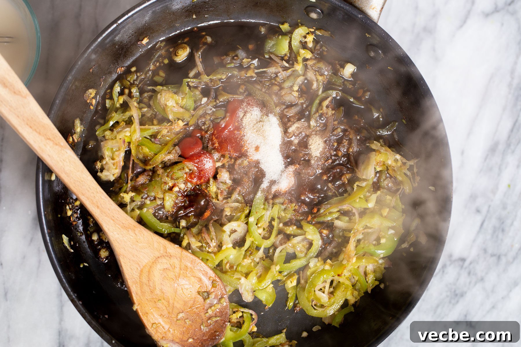 Vegan Chilli Chicken with Soy Curls Recipe 12 sauce ingredients being added to skillet to make Indo Chinese Chilli sauce