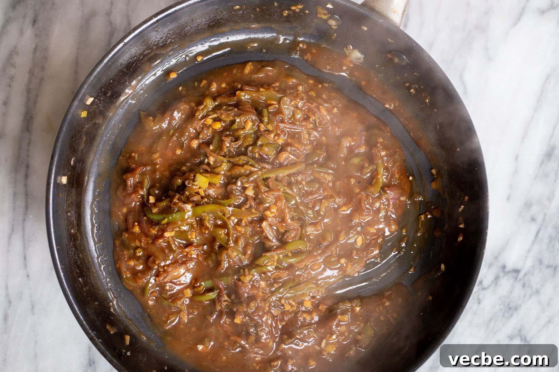 Vegan Chilli Chicken with Soy Curls Recipe 13 spicy Indo Chinese green chilli sauce in a skillet