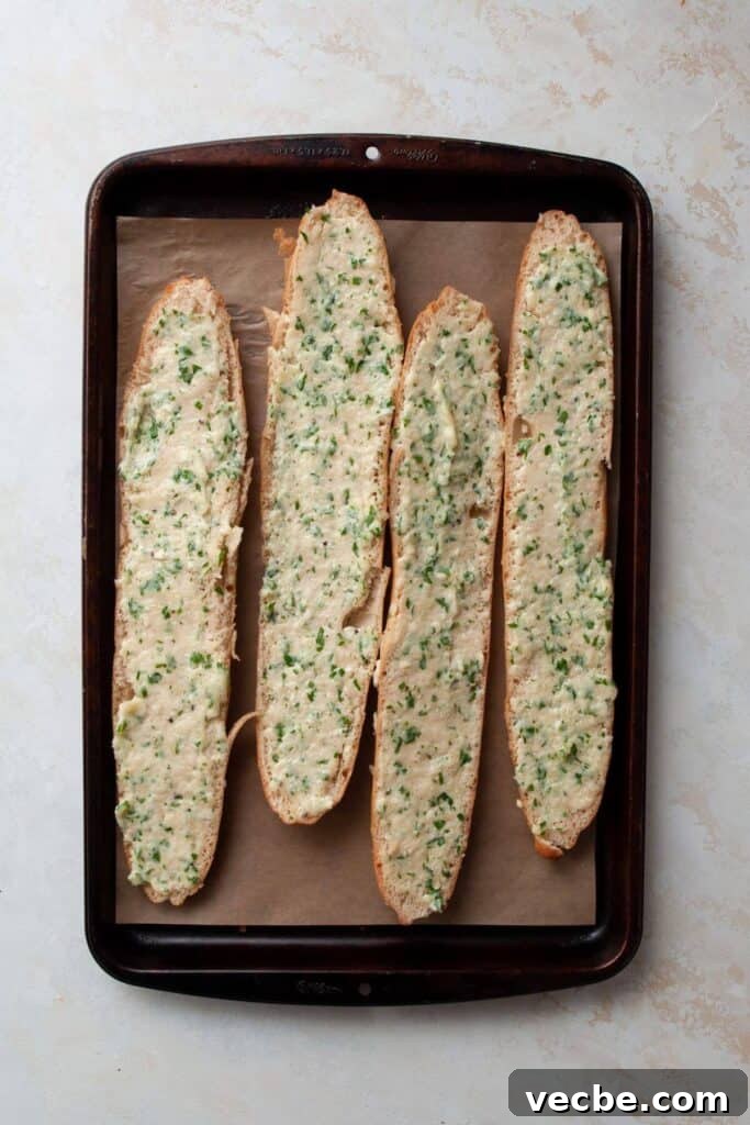 Gluten-Free Garlic Bread Recipe with Crispy Edges 6 garlic butter spread on gluten-free baguettes