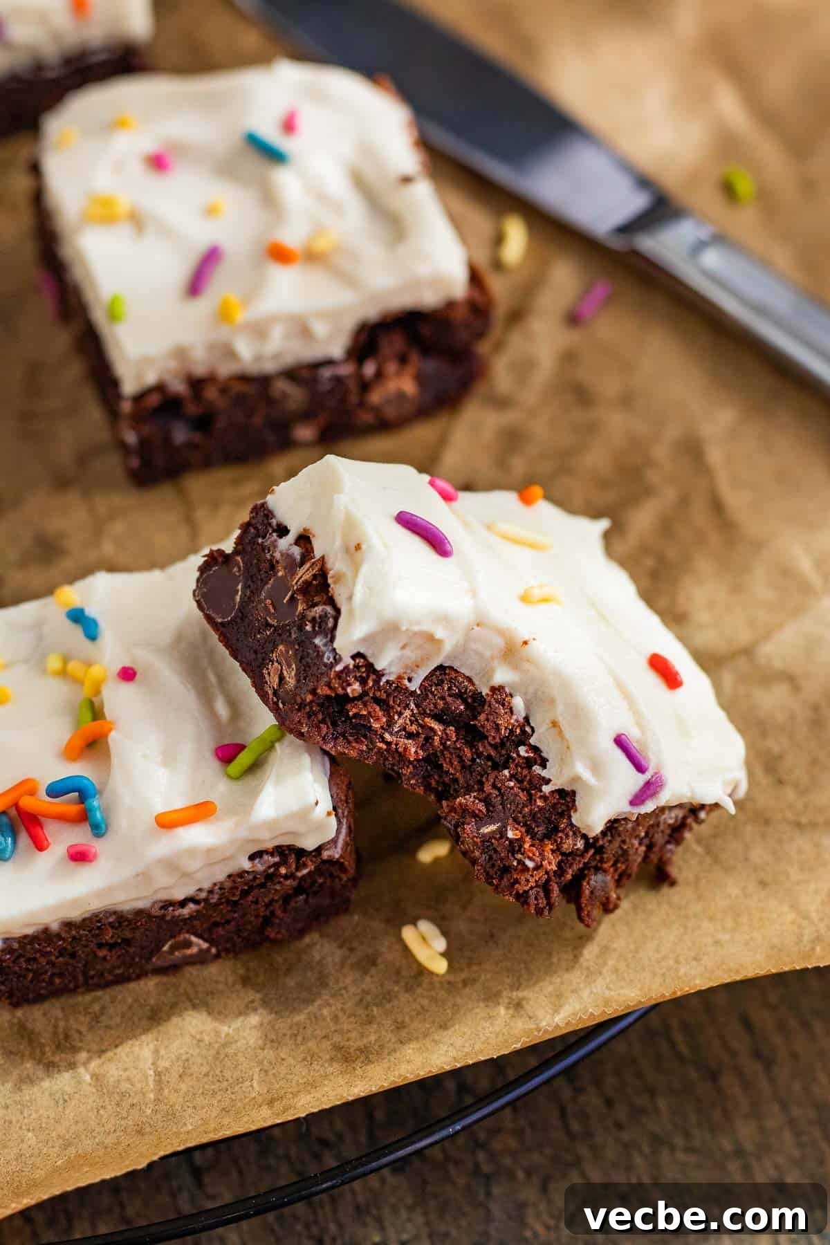 Chewy Brownies with Cream Cheese Frosting Recipe 4 Brownie with cream cheese frosting with a bite taken from the corner