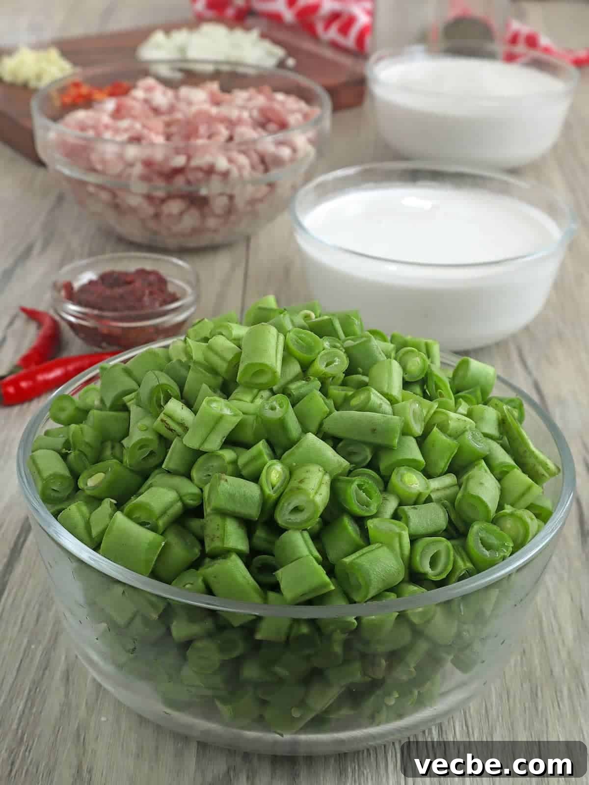 Gising Gising Filipino Green Beans in Spicy Coconut Sauce 3 chopped green beans, ground pork, and coconut milk in individual bowls