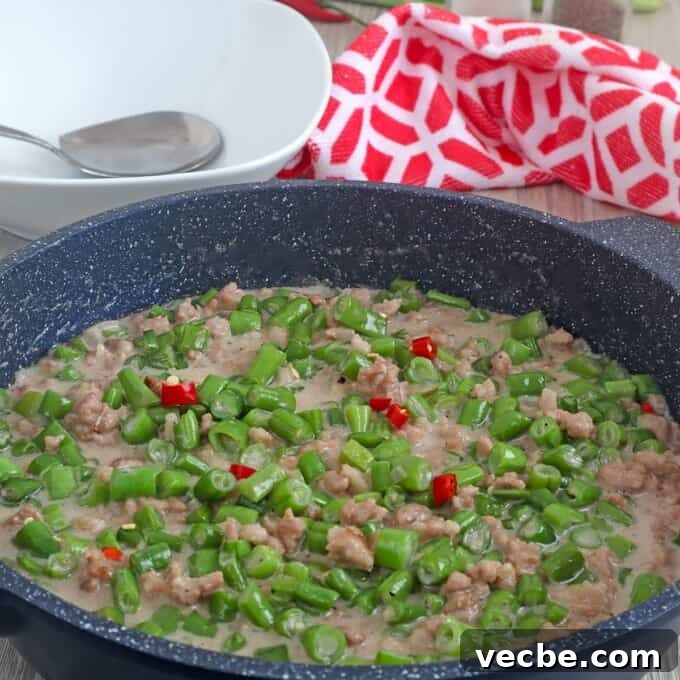 Gising Gising Filipino Green Beans in Spicy Coconut Sauce 7 gising gising dish with ground pork in a skillet