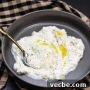 Over 25 Cucumber Recipes for Salads, Sides and Drinks 30 Bowl of tzatziki with olive oil drizzled over the top.
