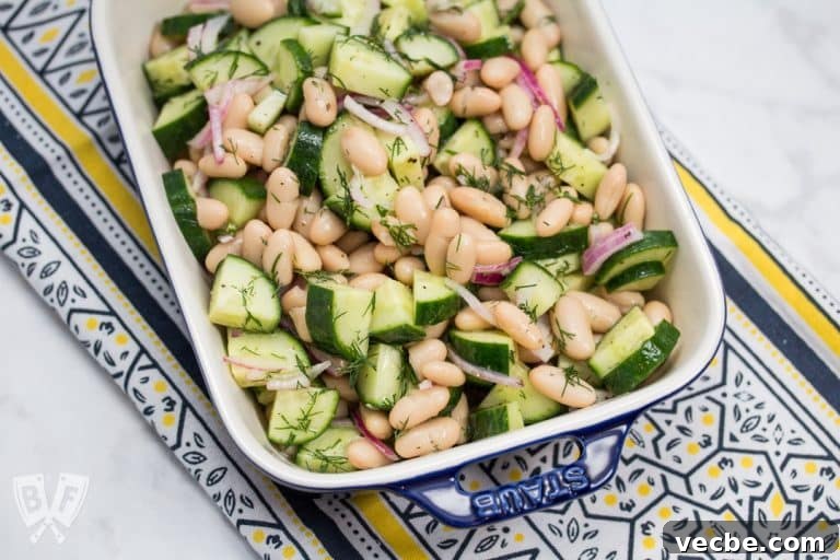 Overhead view of a dish of Cucumber & Cannellini Bean Salad with Dill