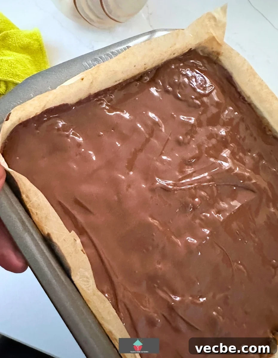 Adding chocolate layer Adding chocolate layer to Chocolate Caramel Walnut Bars