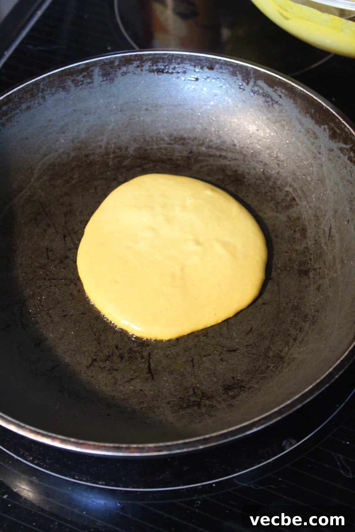 Fluffy Gluten-Free Buckwheat Pancakes Recipe 9 pancake being cooked on a skillet